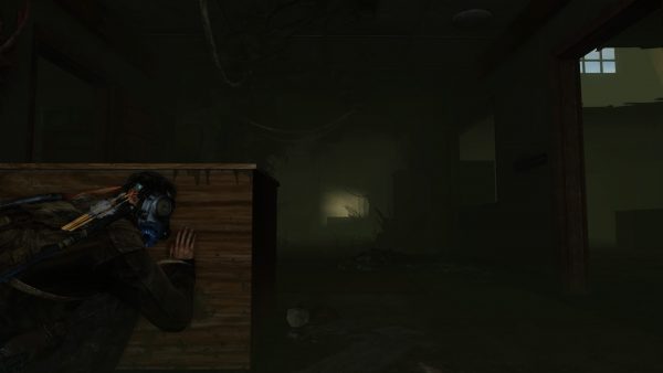 Screenshot of The Last of Us (2013) protagonist Joel sensibly wearing a gas mask in another fungal-infested corridor.